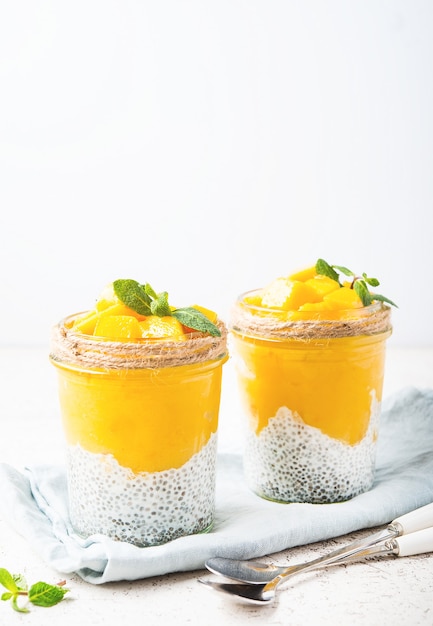 Vegetarian chia pudding with mango in a jar, selective focus