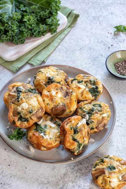 Vegetarian egg muffins with mushroom kale and feta cheese for Breakfast