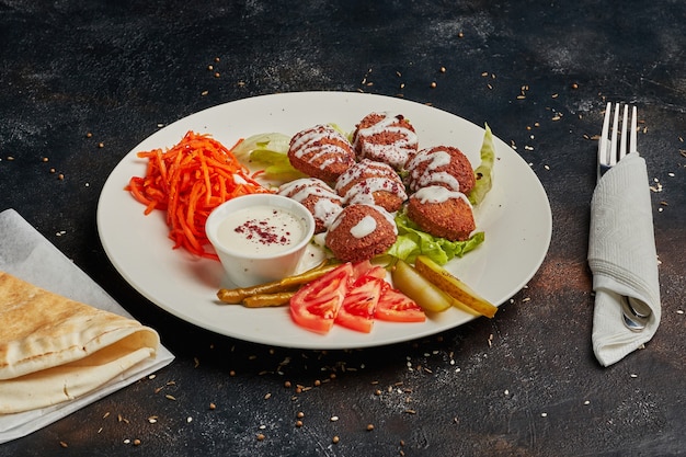 Vegetarian falafels and vegetables on a plate