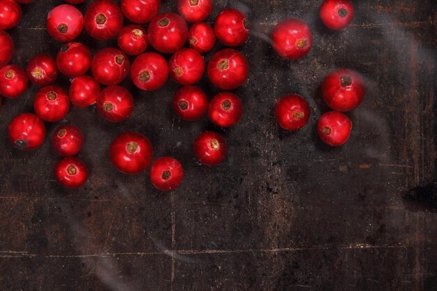 Vegetarian food concept Sweet juicy red currants on a dark background View from above Closeup