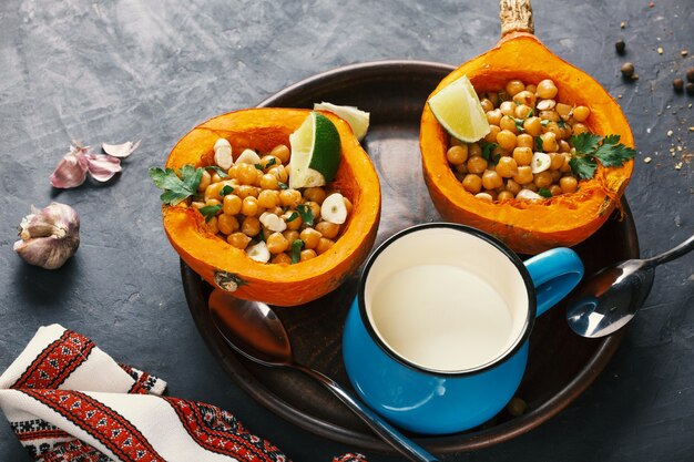 Vegetarian food hokkaido pumpkin with chickpeas and herbs