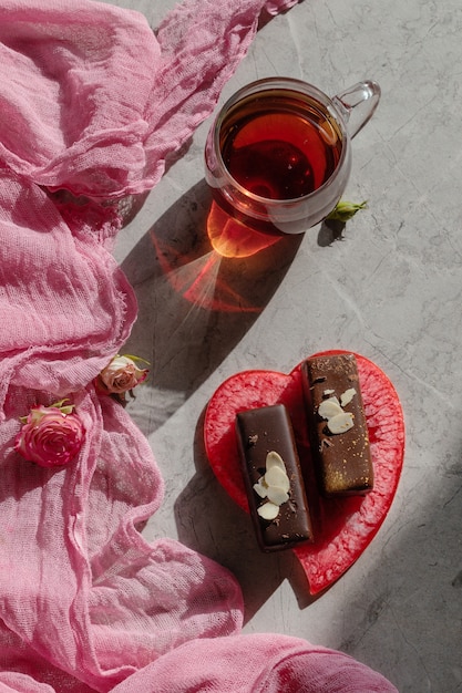 Vegetarian glazed Chocolate cheese on pink background, dessert for vegan children