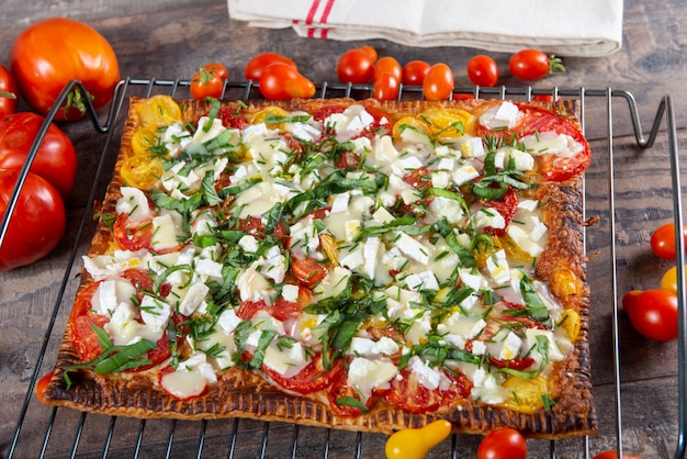 Vegetarian homemade pizza with tomatoes and cheese