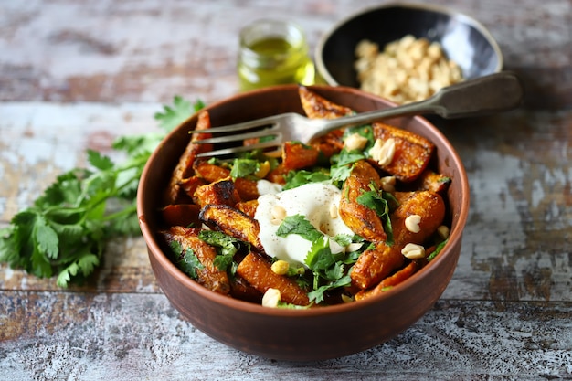 Vegetarian lunch Baked carrot bowl with white cheese