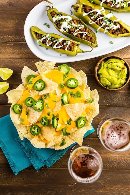 Vegetarian nachos with tortilla chips and fresh jalapeno\
peppers.