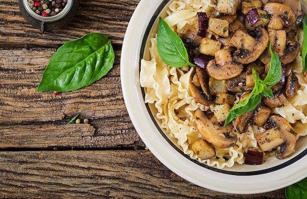 Vegetarian pasta with mushrooms and aubergines, eggplants.