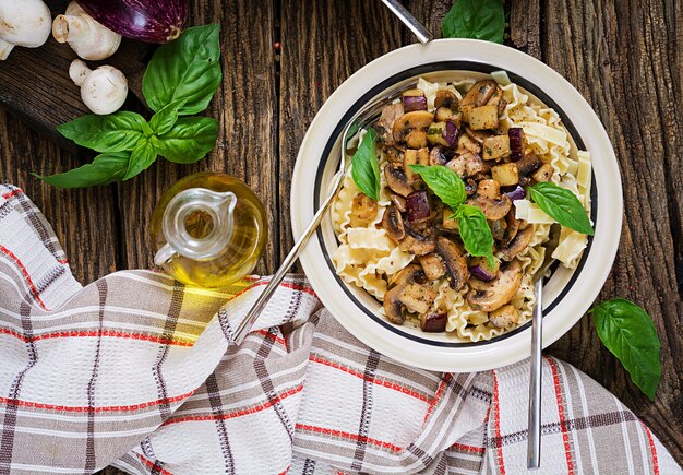 Vegetarian pasta with mushrooms and aubergines, eggplants.