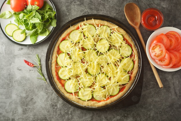 Vegetarian pizza. Cooking process of vegetable homemade pizza.