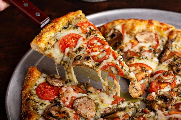 Vegetarian pizza with mushrooms and pesto sauce