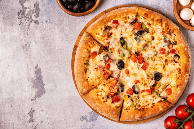 Vegetarian pizza with mushrooms, vegetables, cheese