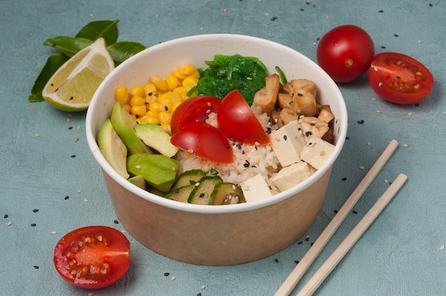 Vegetarian poke with avocado, mushrooms, corn, chuka, tofu cheese, cucumbers and cherry tomatoes