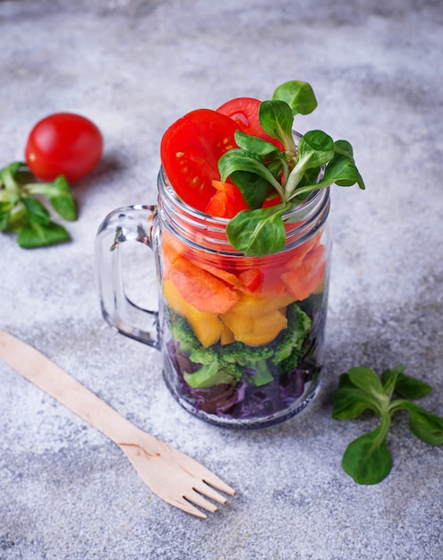 Vegetarian rainbow salad in a glass jar