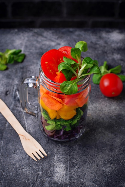 Vegetarian rainbow salad in a glass jar