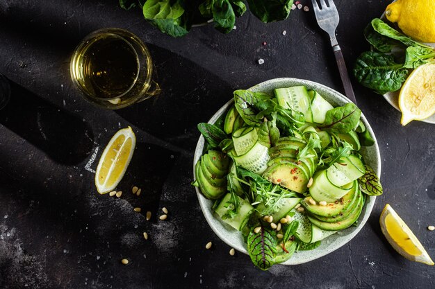 Vegetarian salad with avocado, cucumber and herbs