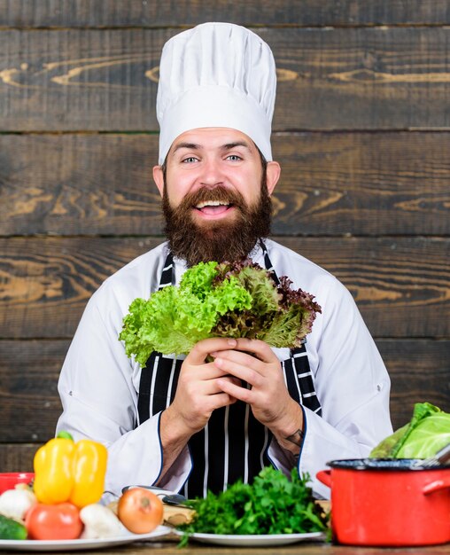 Vegetarian salad with fresh vegetables. Dieting organic food. Cuisine culinary. Vitamin. Happy bearded man. chef recipe. Healthy food cooking. Mature hipster with beard. Juicy and sweet.