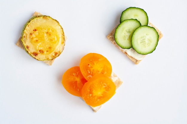 Vegetarian sandwiches vegetables on crusty bread on a white background