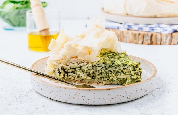 Vegetarian spinach pie with feta cheese on white background traditional greek spinach pie spanakopita