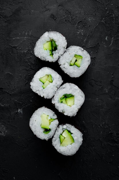 Vegetarian sushi roll with cucumber Japanese cuisine Top view