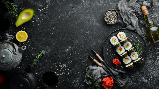 Vegetarian sushi with avocado and tomatoes Sushi Set Top view Free space for your text