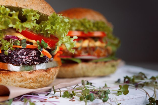 Veggie burger on a black wooden background