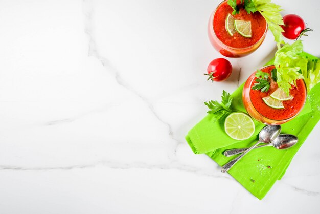  veggie food, Cold soup gazpacho in glasses with with fresh celery, parsley and lime juice