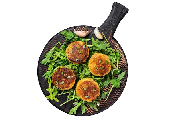 Veggie patty cutlet with lentils vegetables and arugula Isolated on white background