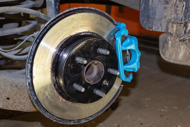 Vehicle disc brake for repair in the process of replacing new tires Repair of car brakes in the garage