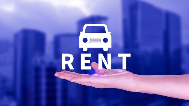 Vehicle transportation investment and car mortgage financial concept Realtors hand puts with icon car and word RENT Rent a car