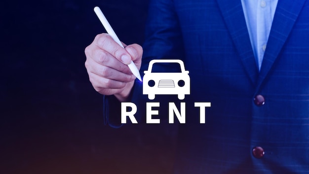 Vehicle transportation investment and car mortgage financial concept Realtors hand puts with icon car and word RENT Rent a car