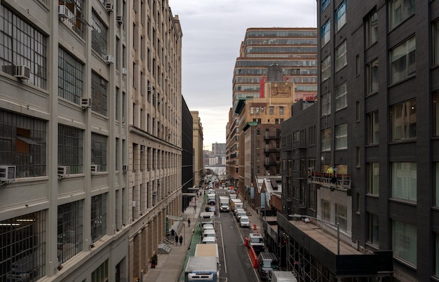 Vehicles on road amidst buildings in city