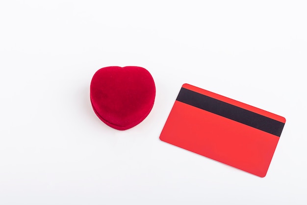 Velvet heart-shaped ring box and blank credit card