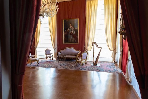 Venaria Reale Italy luxury interior old Royal Palace Perspective with harp window and baroque decoration