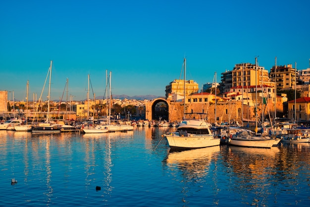 Venetian fort in heraklion and moored fishing boats crete island greece