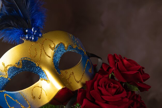 Venetian mask, roses and smoke in beautiful shapes