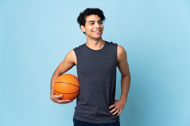 Venezuelan basketball player man over posing with arms at hip and smiling