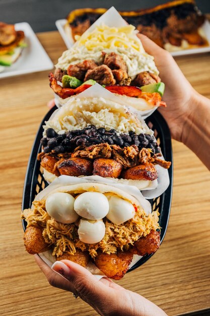 Photo venezuelan food on a table arepas tostones cachapas empanadas typical venezuelan gastronomy