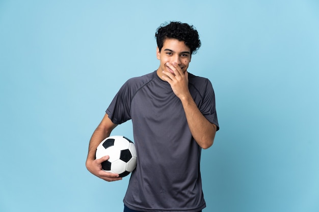 Venezuelan football player man happy and smiling coning mouth\
with hand