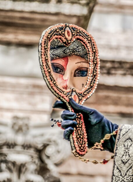 Venice carnival mask during carnival in venice italy