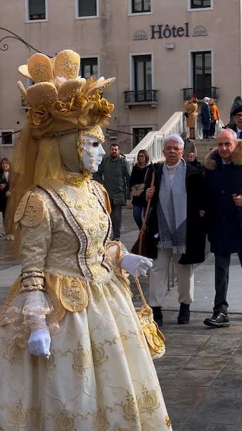 Venice Carnival People in Venetian carnival masks and costumes on streets of Venice Italy Europe February 10 2024