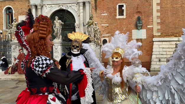 Venice Carnival People in Venetian carnival masks and costumes on streets of Venice Italy Europe February 10 2024