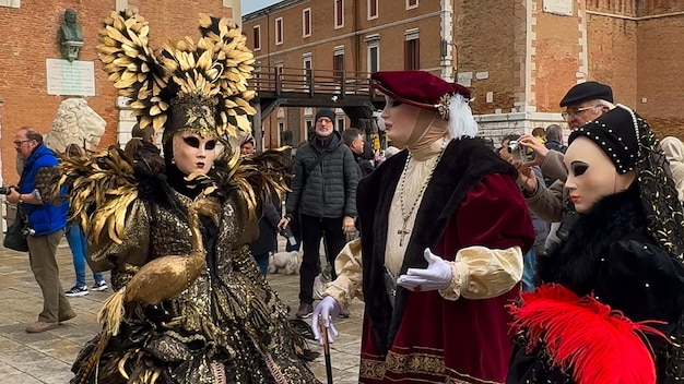 Venice Carnival People in Venetian carnival masks and costumes on streets of Venice Italy Europe February 10 2024