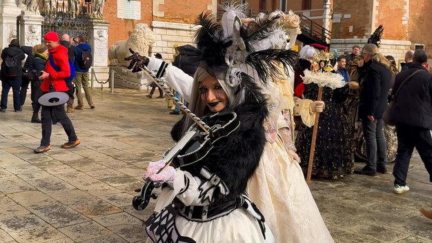 Venice Carnival People in Venetian carnival masks and costumes on streets of Venice Italy Europe February 10 2024