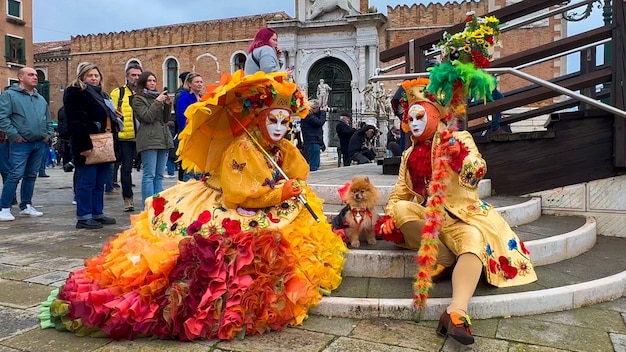 Venice Carnival People in Venetian carnival masks and costumes on streets of Venice Italy Europe February 10 2024