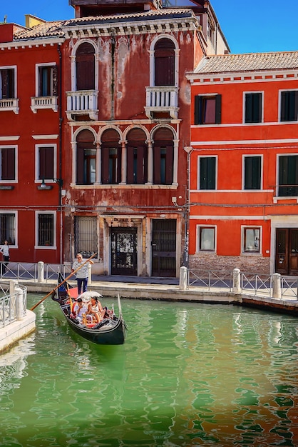 Venice Italy July 30 2023 Small waterways of Venice A gondola floats down a canal in Venice I