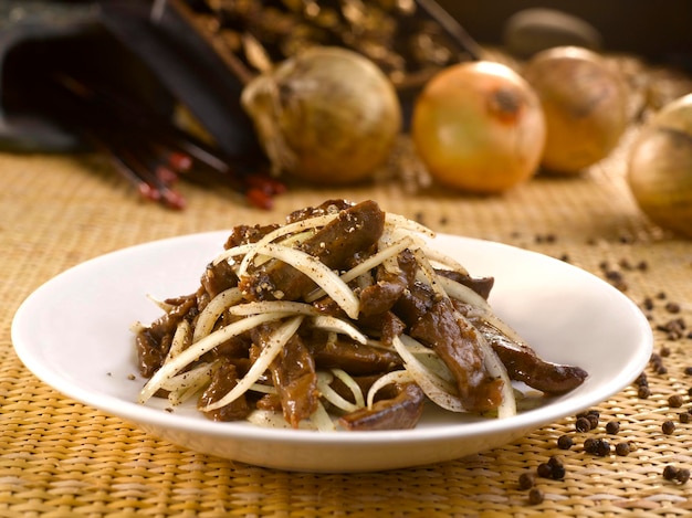 Venison with Black Pepper served in a dish isolated on table side view