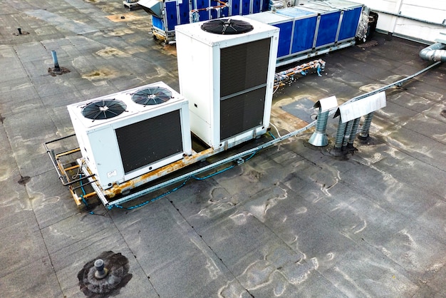 Ventilation and air conditioning system on the roof of an office or industrial building View from above Air cleaning Drone photography