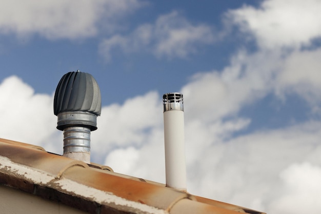 Ventilators and rooftop chimneys at close quarters