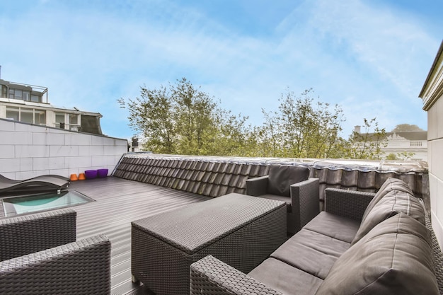 Veranda on the roof of the house with a comfortable sofa