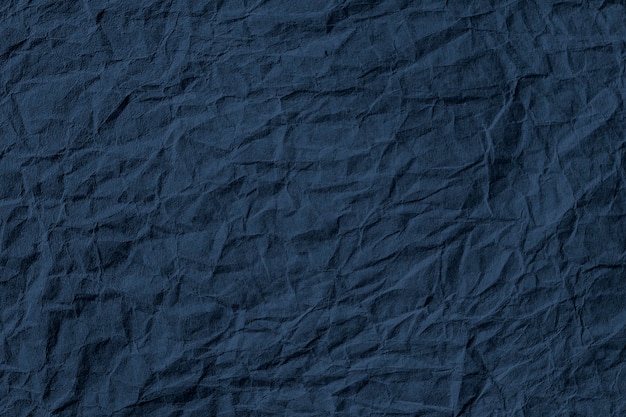 Verfrommeld donkerblauw papier getextureerde achtergrond