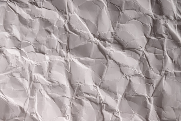 Verfrommeld papier. vel grijs-wit papier. gedetailleerde hoge resolutie textuur. abstracte achtergrond voor behang.